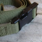 green fastening strap with quick-release buckles