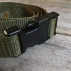 green fastening strap with quick-release buckles